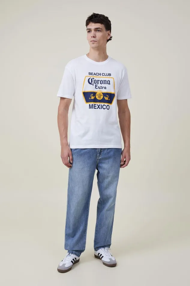 Cotton On Tees and Tanks Corona Premium Loose Fit TShirt Lcn Cor Whitecorona 8211 Beach Club 8211 Men Cotton On Tees and Tanks Corona Premium Loose Fit TShirt Lcn Cor Whitecorona 8211 Beach Club 8211 Men