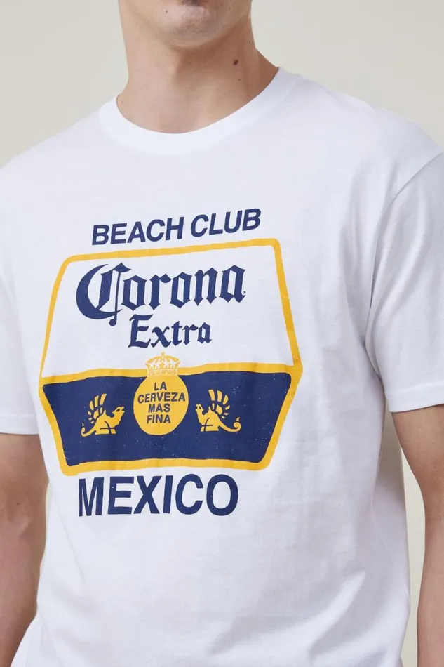 Cotton On Tees and Tanks Corona Premium Loose Fit TShirt Lcn Cor Whitecorona 8211 Beach Club 8211 Men Cotton On Tees and Tanks Corona Premium Loose Fit TShirt Lcn Cor Whitecorona 8211 Beach Club 8211 Men